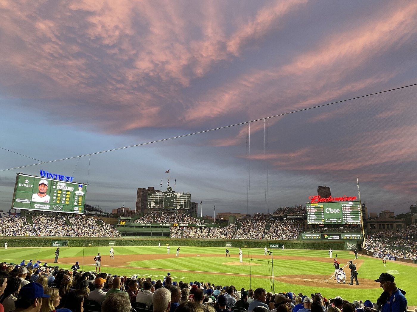 Sunset over Wrigley Field in Chicago, the ballpark hosting the Reds and Cubs under 9.5 on tonight's card